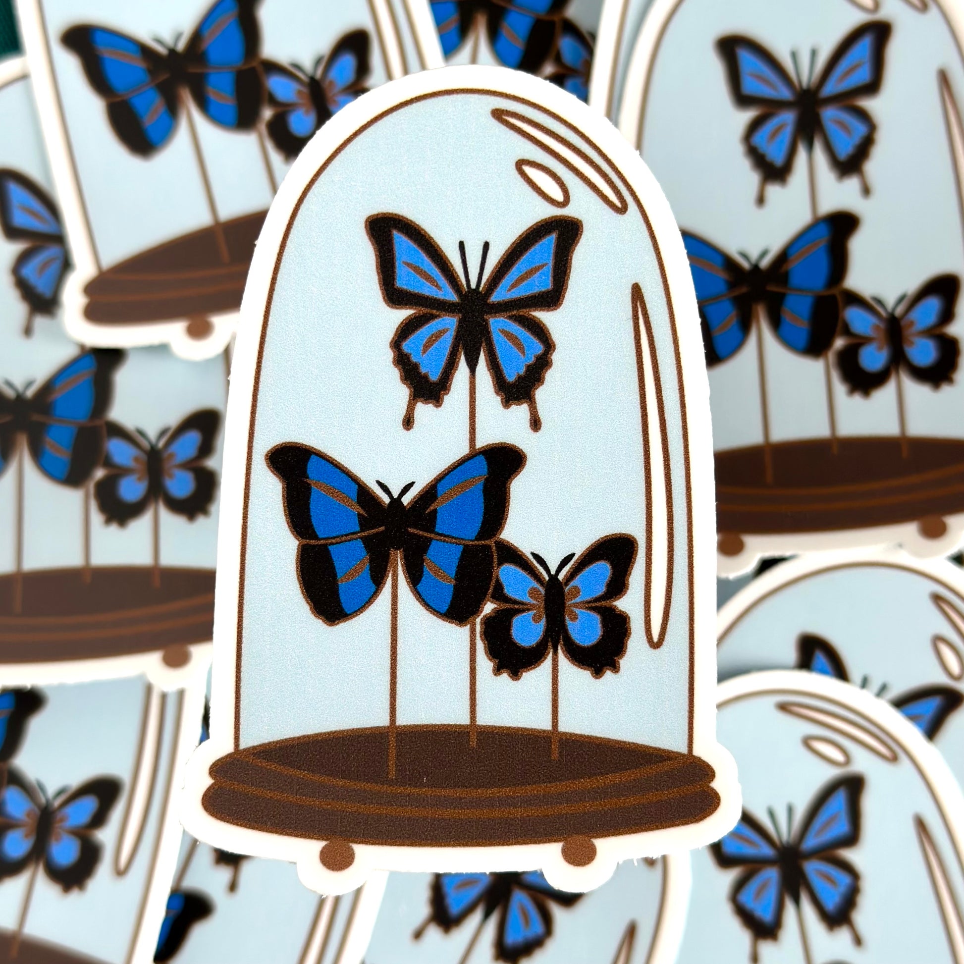 Blue butterflies in a glass dome sticker