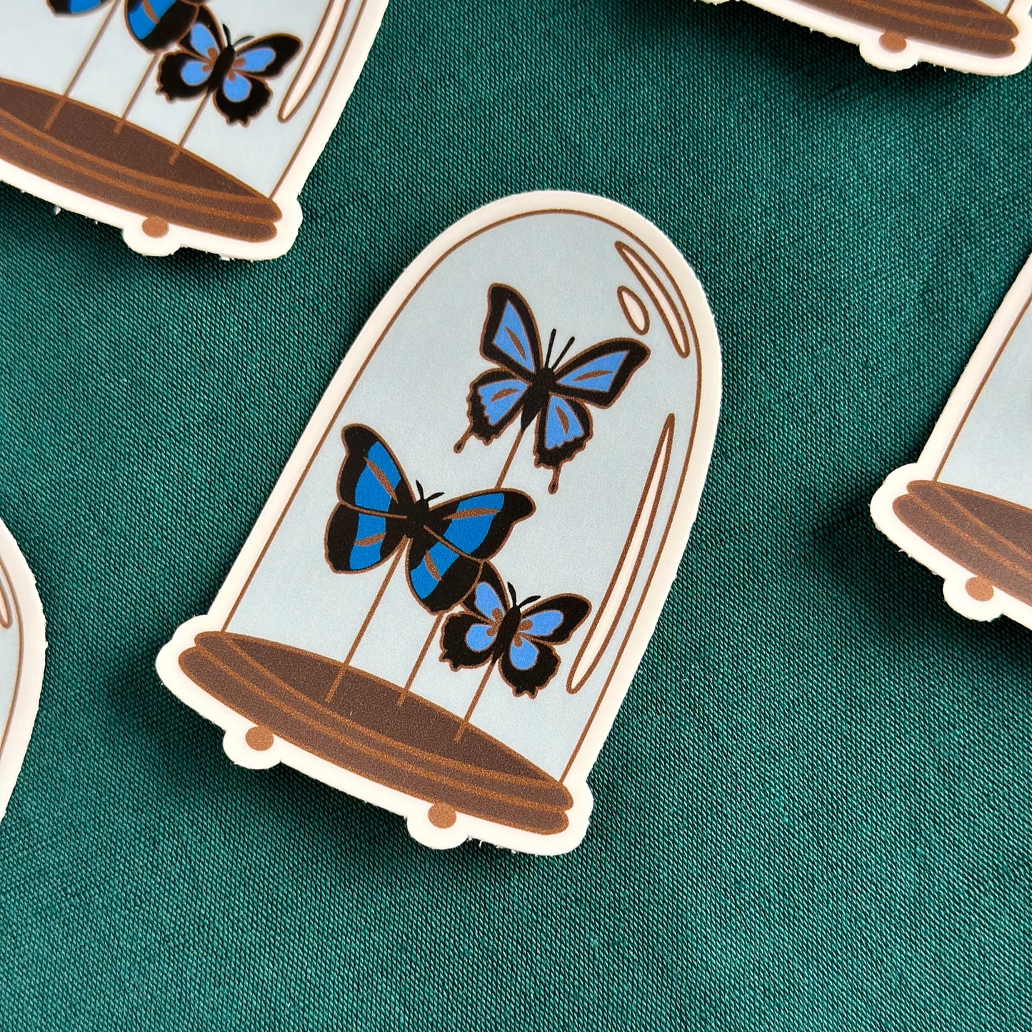 Blue butterflies in a glass dome sticker